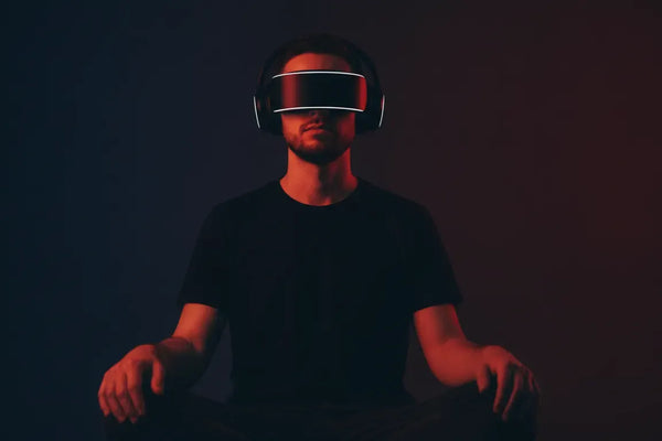 Person wearing a NeuroVIZR-style audio-visual brainwave entrainment headset in a dark, calm room