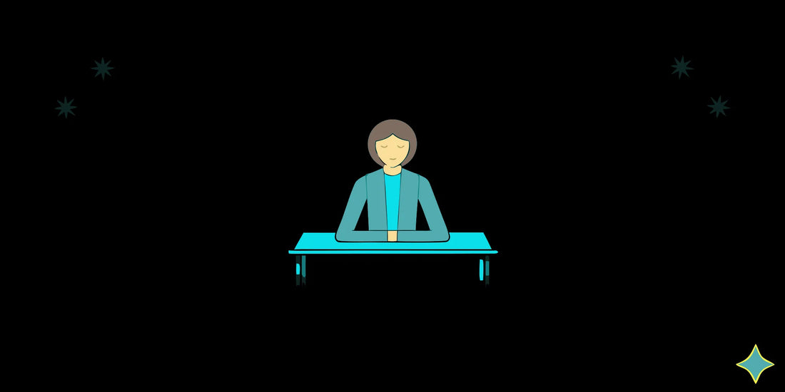 A person at a desk with eyes closed, taking a moment to regulate their nervous system.