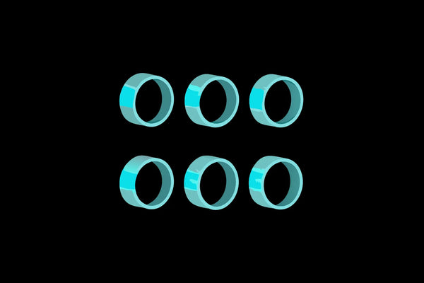 Six of the best wearable stress relief devices on a black background.