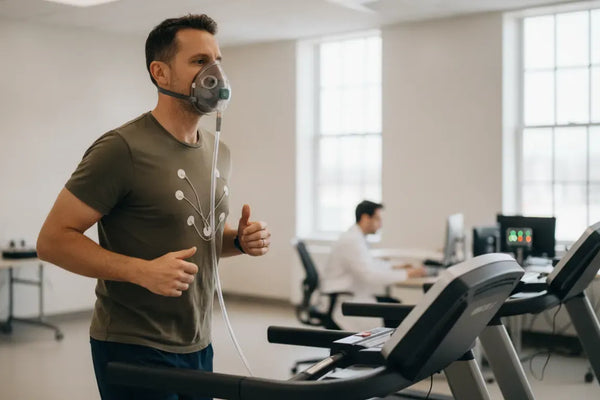 Busy professional completing a supervised VO2 max test on a treadmill